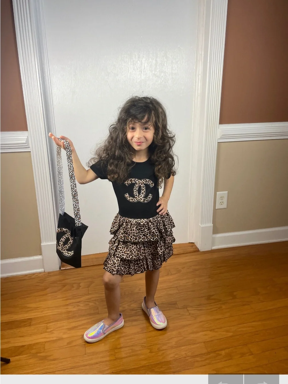 CHANEL Black Tee with Monochrome Leopard Ruffle Skirt & Pouch